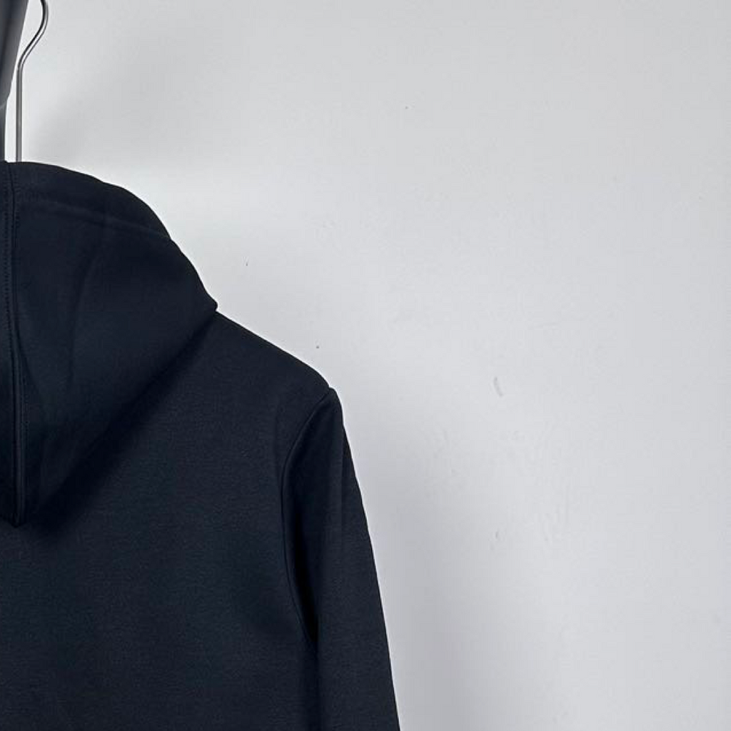 Dark zip-up hoodie side view with smooth sleeve and hood edge