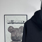 Dark zip-up hoodie hood and upper back area with front zipper placket