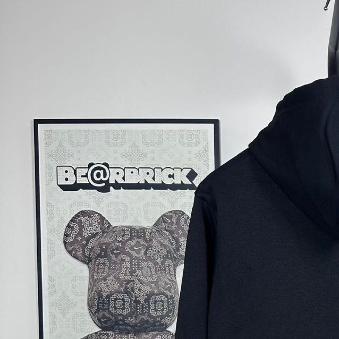 Dark zip-up hoodie hood and upper back area with front zipper placket