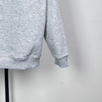 Light gray long-sleeve sweatshirt with ribbed cuffs