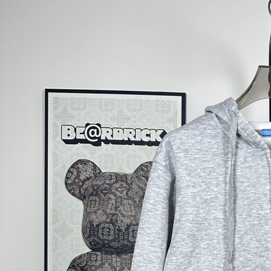 Prada heather gray zip-up hoodie, raised hood and drawstring, shoulder close-up