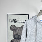 Prada heather gray zip-up hoodie, raised hood and drawstring, shoulder close-up
