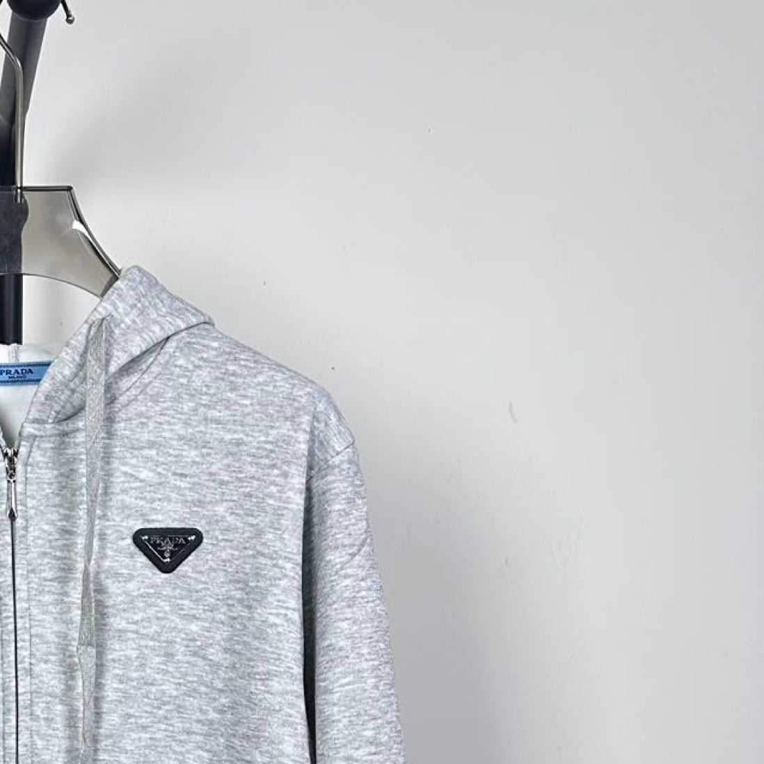 Prada heather gray zip-up hoodie, chest logo triangle and hood close-up