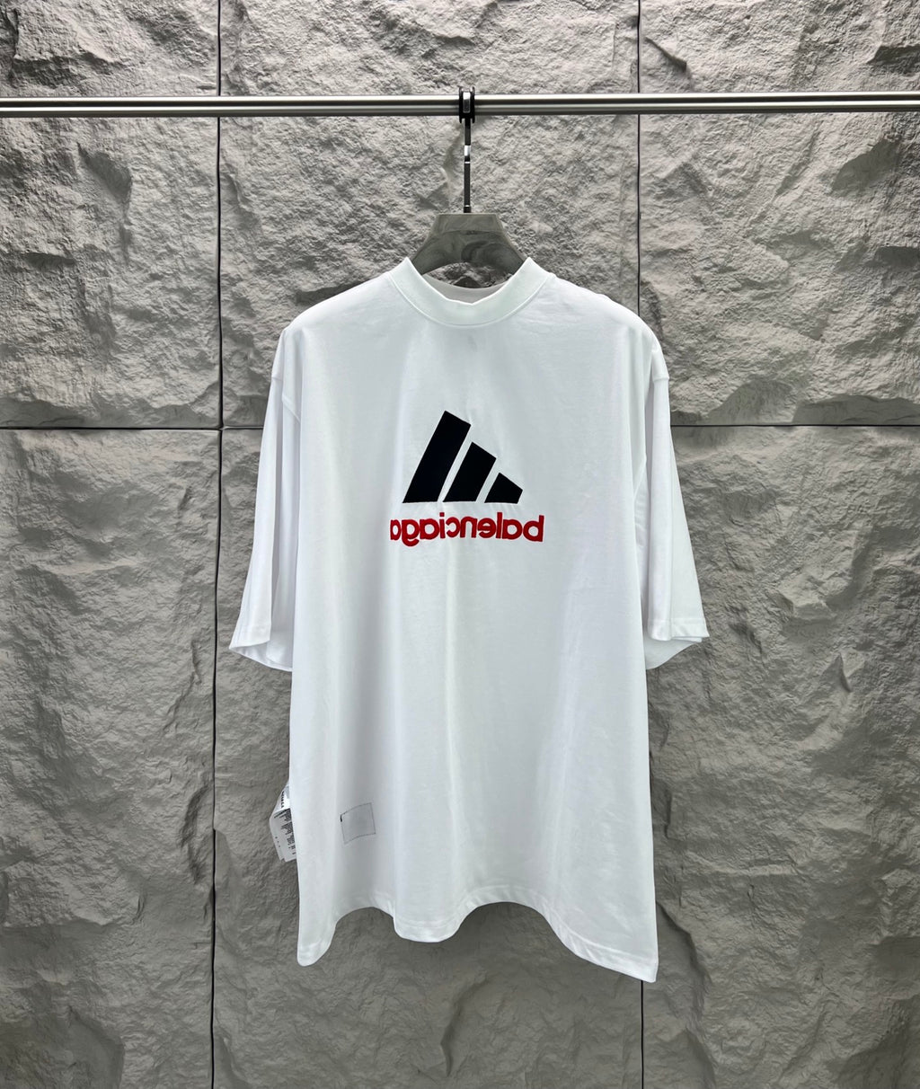 White T-shirt with large black graphic bars and red text print at center chest