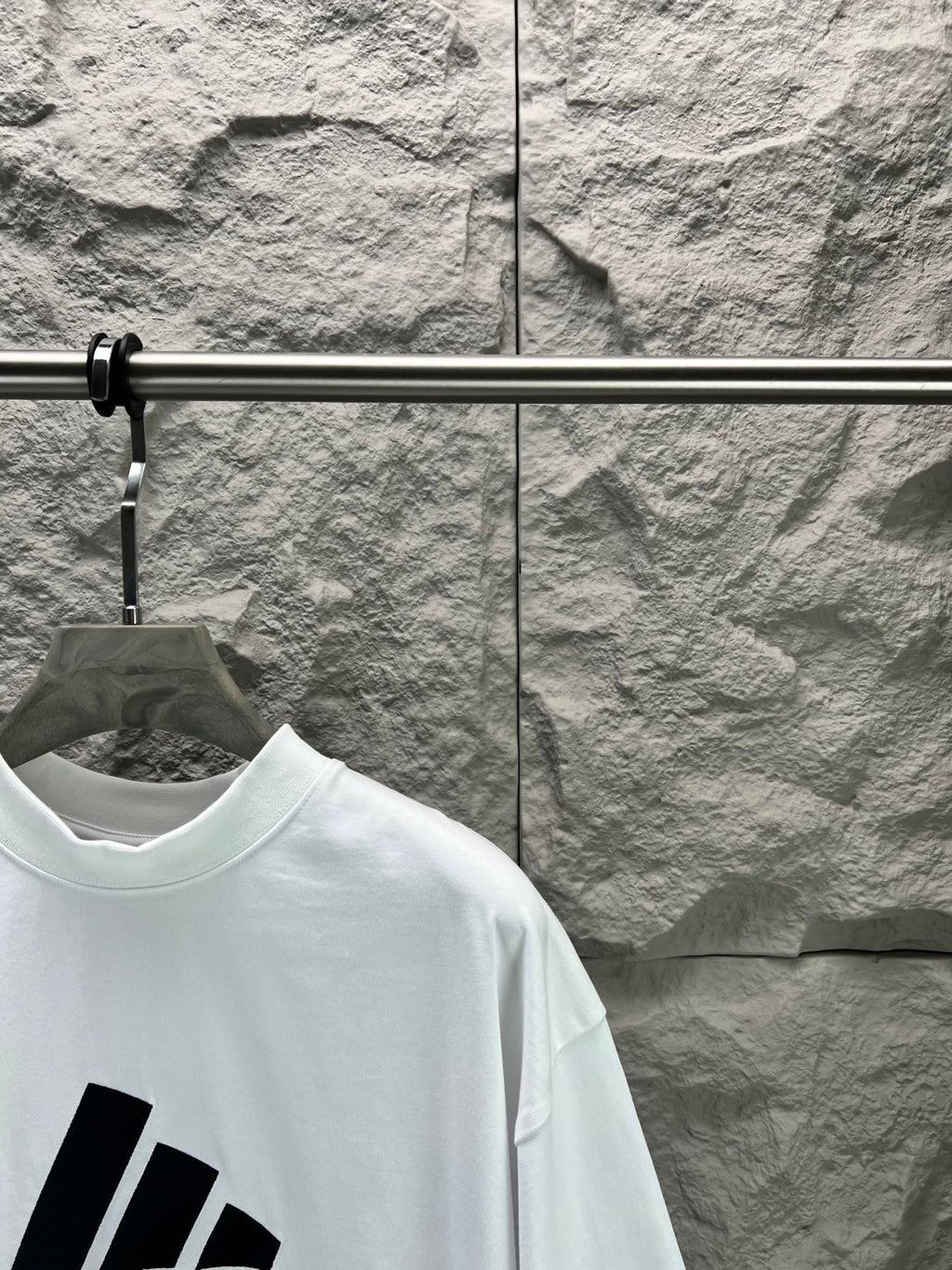 White T-shirt shoulder with large black stripe graphic print