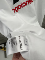 White size label on T-shirt sleeve reading BALENCIAGA