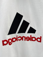 White T-shirt with close-up black stripe logo and red mirrored text