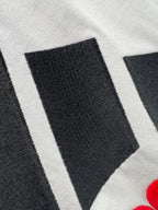 White T-shirt fabric with black stripe logo graphic detail
