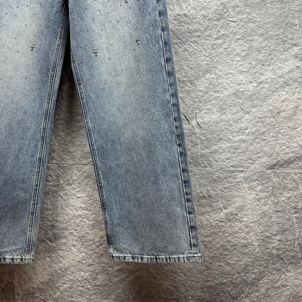 Light blue denim pants with wide straight legs and frayed hem at cuffs