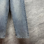 Light blue denim pants with wide straight legs and frayed hem at cuffs