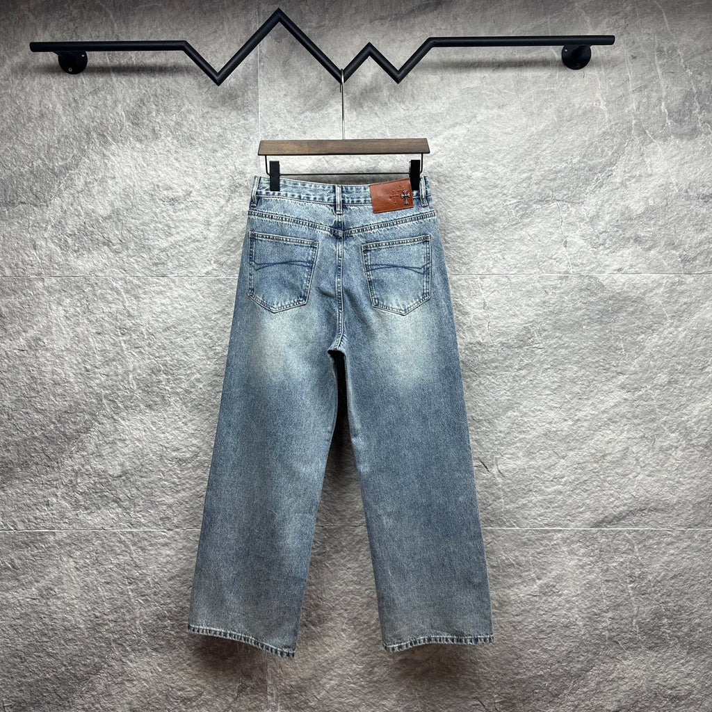 Light blue wide-leg denim pants with back button and belt loops