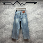 Light blue wide-leg denim pants with back button and belt loops