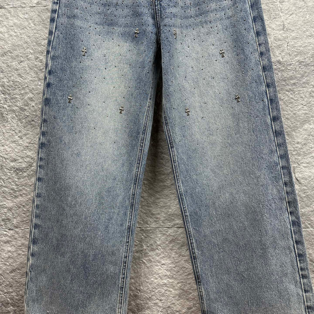 Light blue denim pants with scattered star-like speckles across the legs
