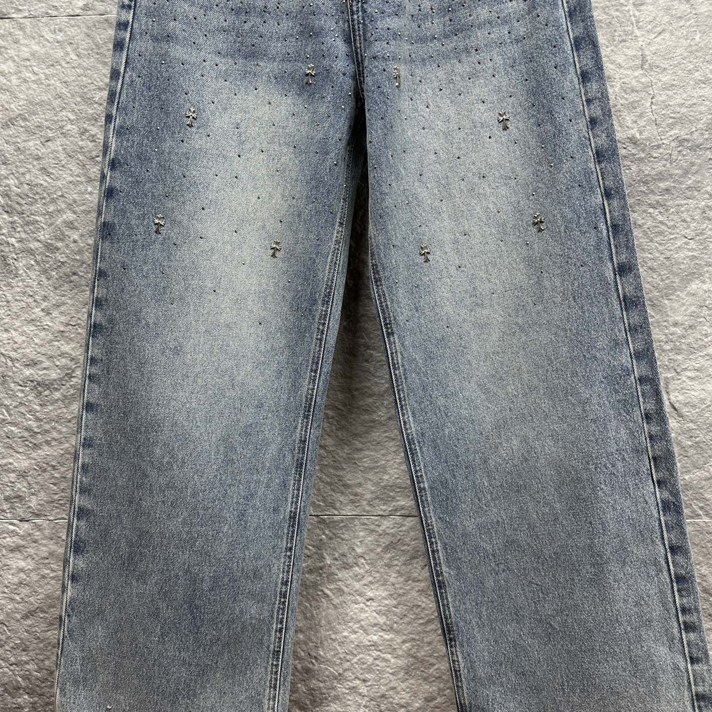 Light blue denim pants with scattered star-like speckles across the legs