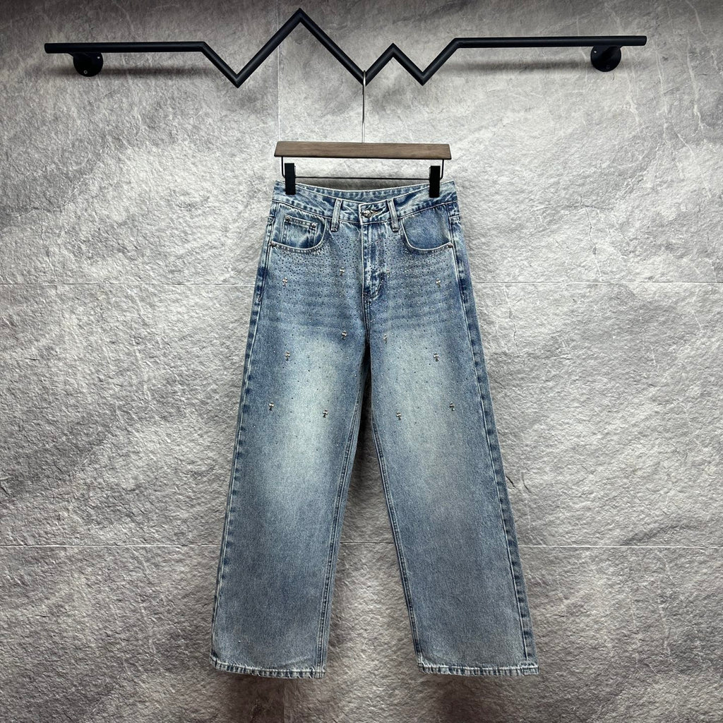 Light blue denim pants with wide legs, belt loops, and front slash pockets