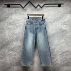 Light blue denim pants with wide legs, belt loops, and front slash pockets