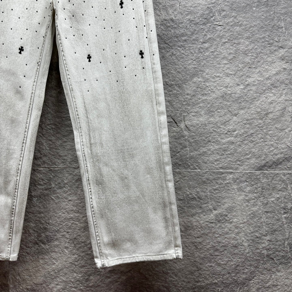 White denim pants lower legs with stitched seam and straight hem