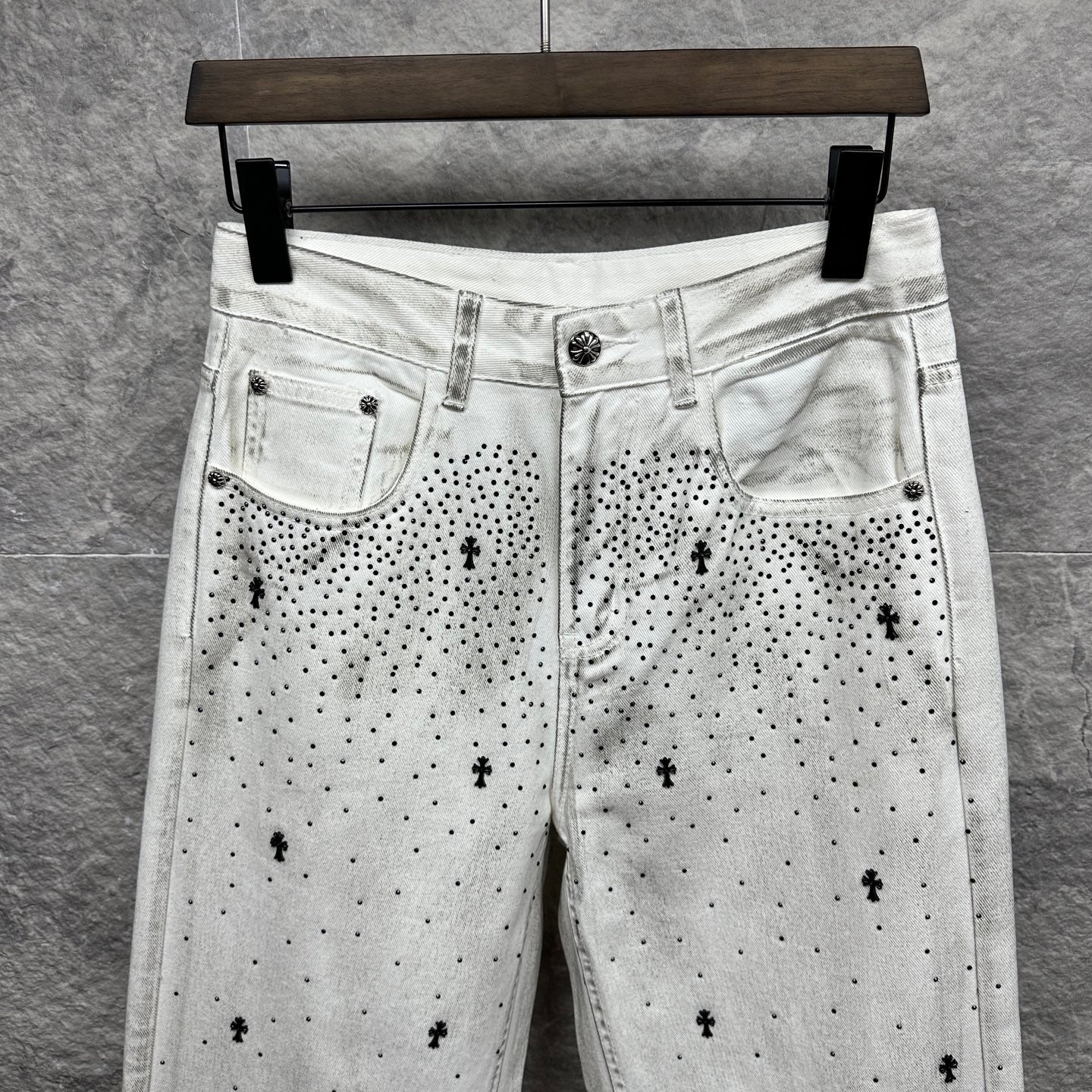 White denim pants with black dot cross print and front patch pockets