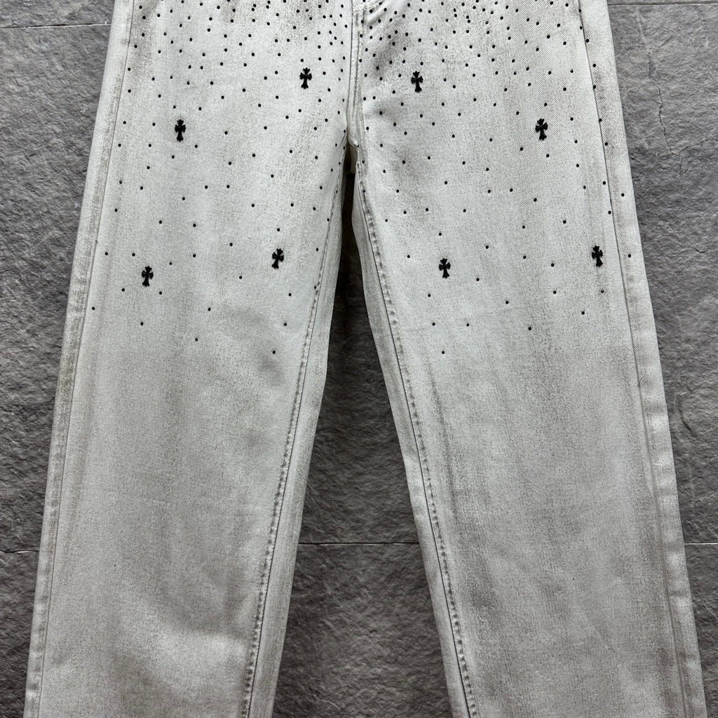 White denim pants with all-over black dot and cross print on legs