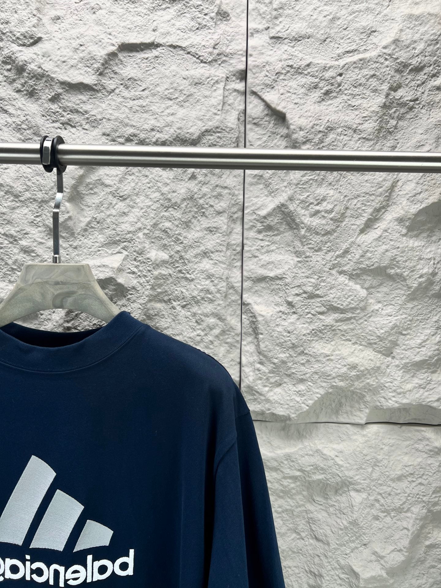 Balenciaga short sleeve T-shirt front logo partial view in dark blue