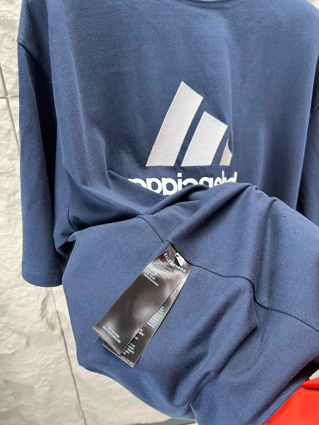 Balenciaga short sleeve T-shirt in dark blue with tag attached on sleeve