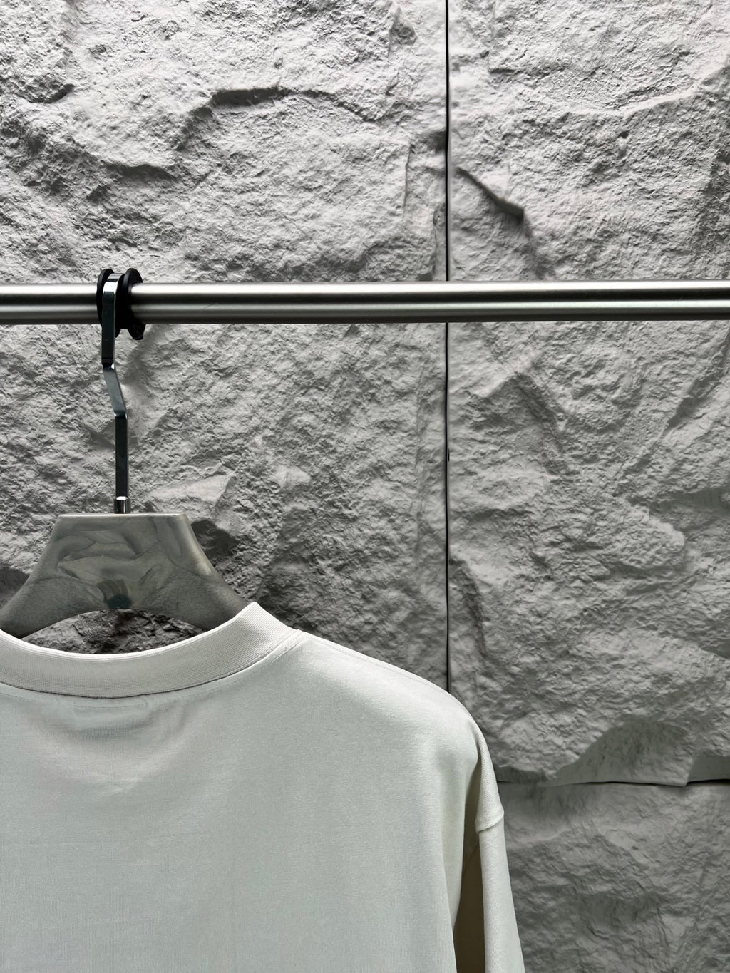 White T-shirt shoulder and upper back view with crew neck
