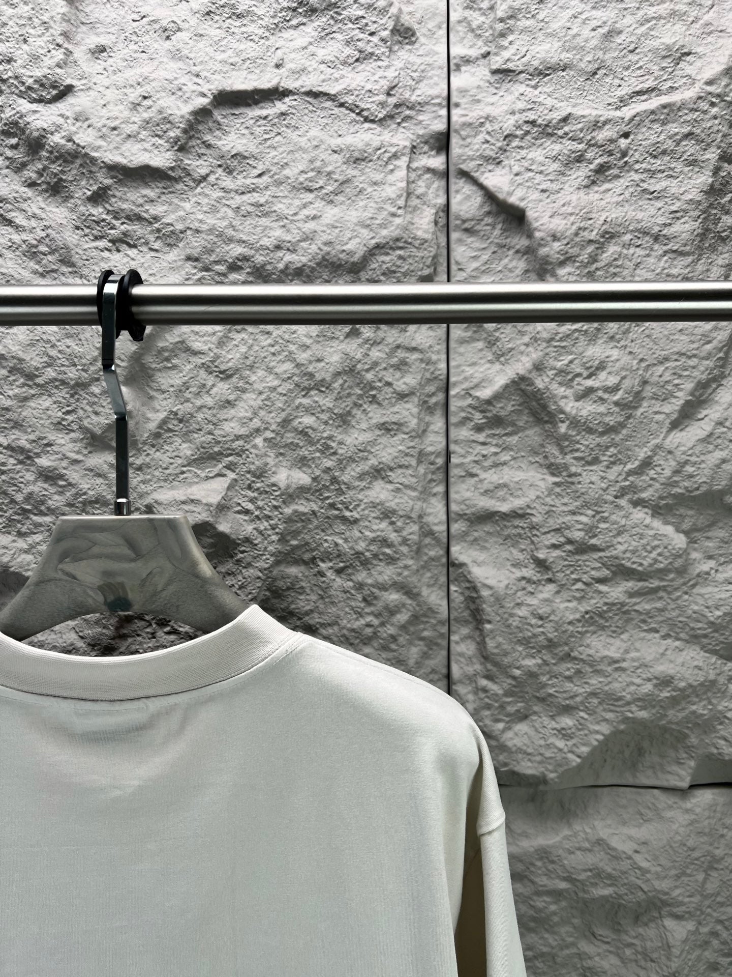 White T-shirt shoulder and upper back view with crew neck