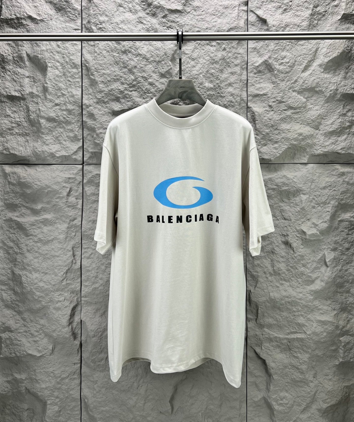 White crew-neck T-shirt with Balenciaga graphic logo on the chest