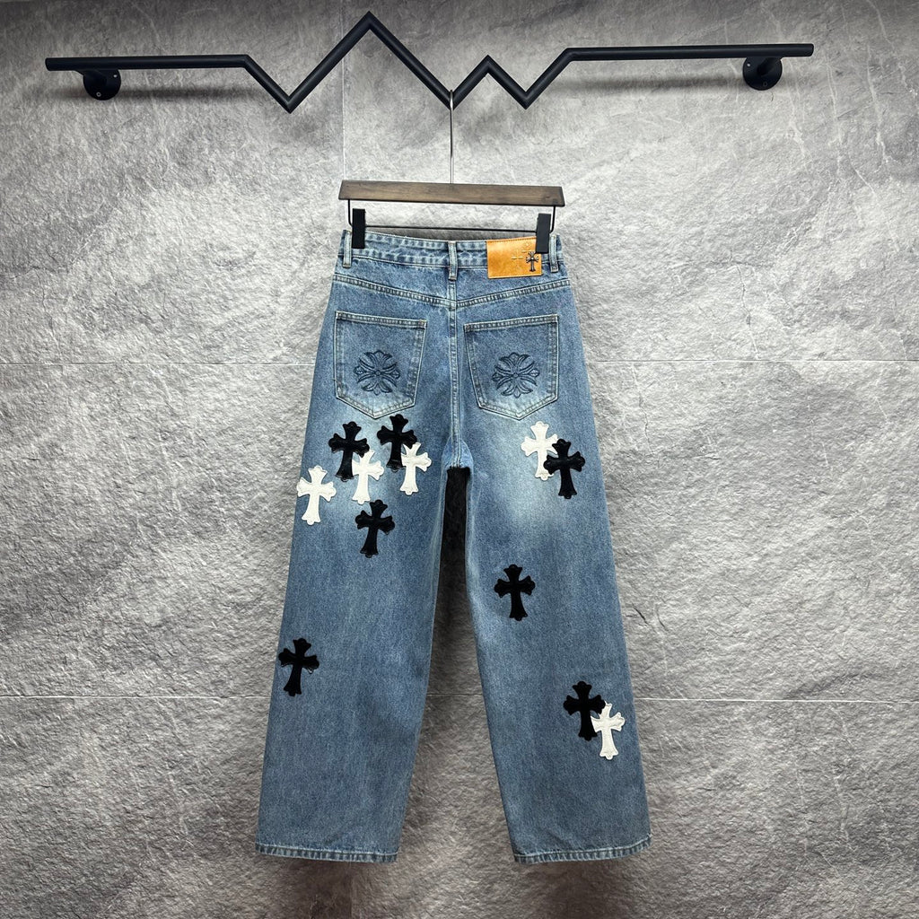 Light blue denim pants with all-over black and white cross applique patches