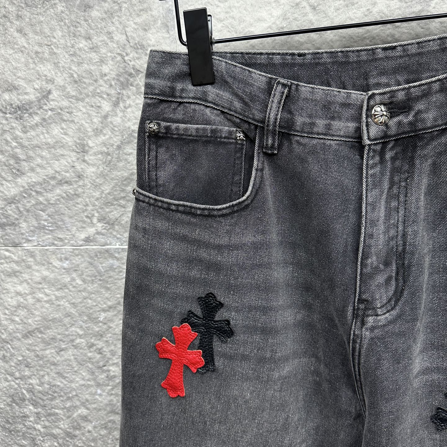 Grey denim pants with belt loops and side pocket, red cross applique
