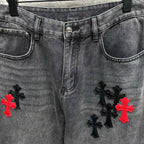 Grey denim pants with waistband detail, side pockets, and cross embroidery