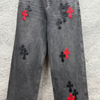 Grey denim pants with scattered cross embroidery in red and black