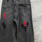 Grey denim pants with front fly and pocket details, cross embroidery on legs