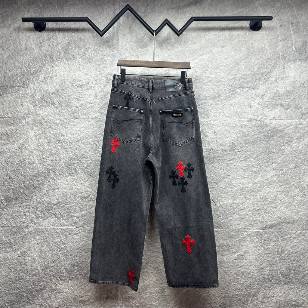 Grey denim pants with cross embroidery in red and black, back view
