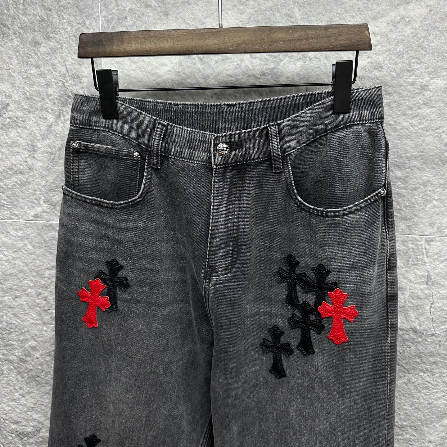 Grey denim pants with cross embroidery on front thighs and side pockets