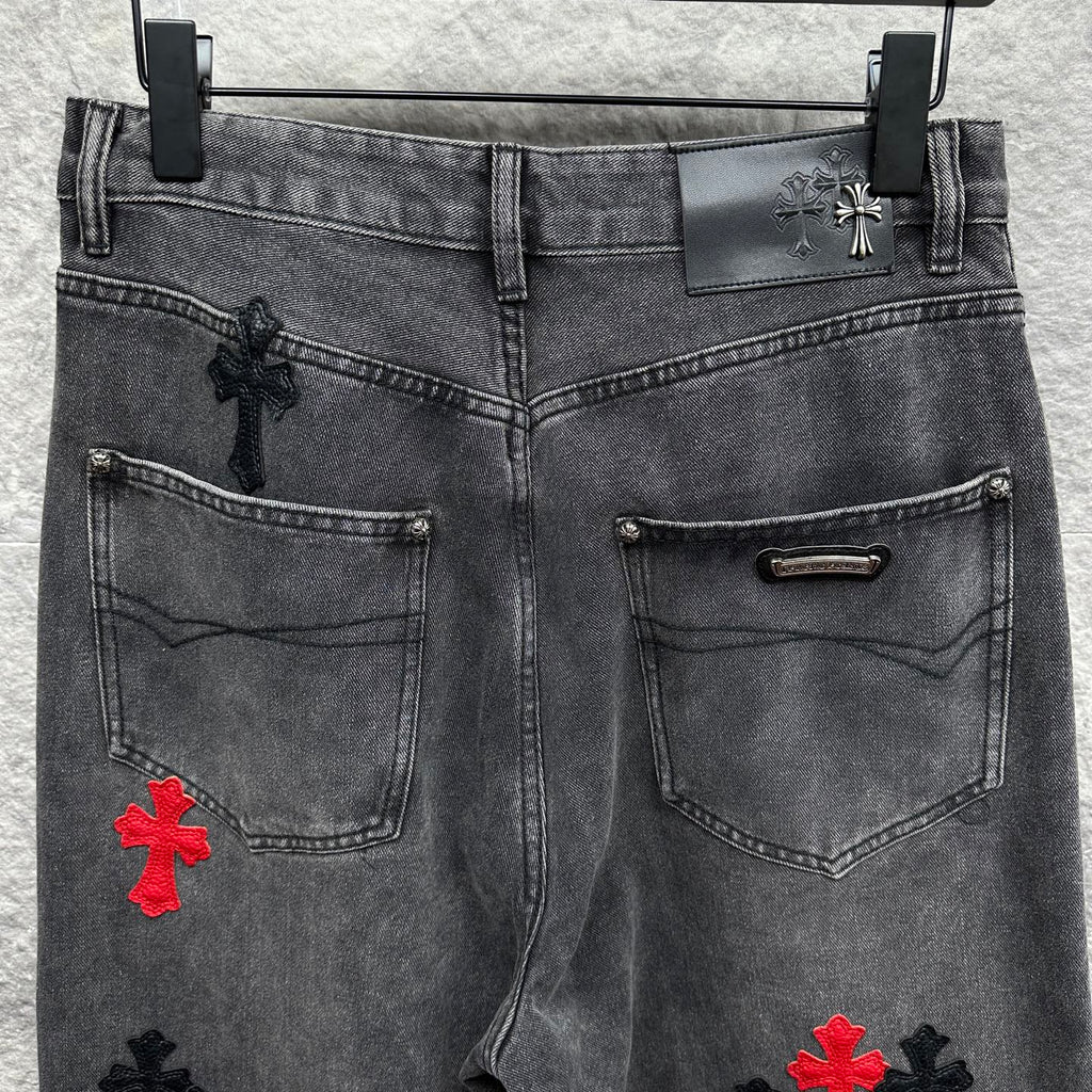 Grey denim pants with front pockets, dark cross embroidery and red cross