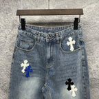 Light-wash denim pants with cross patches on the front, mid-rise waistband