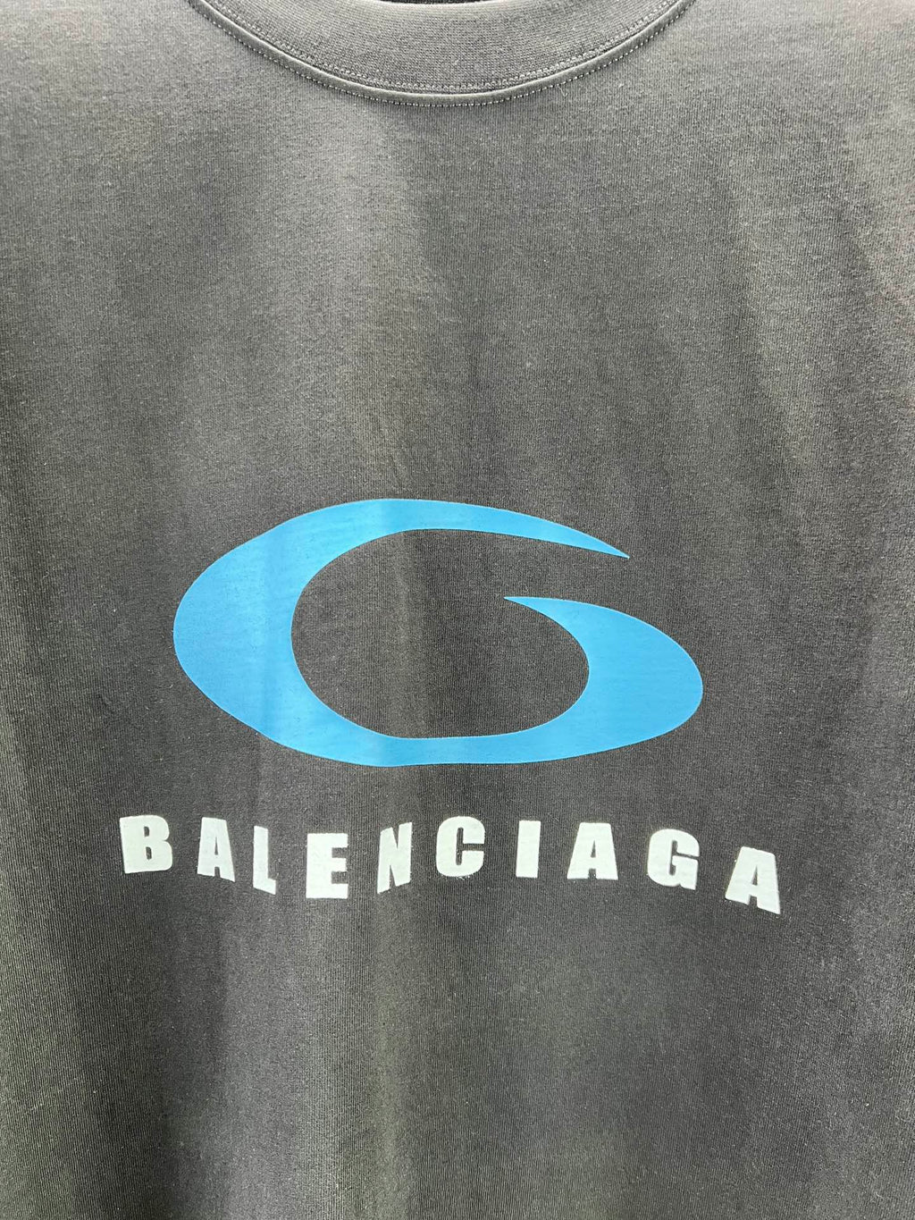 Balenciaga T-shirt close-up of blue G logo and BALENCIAGA lettering