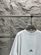 White crew-neck T-shirt with small chest logo and relaxed shoulder fit.