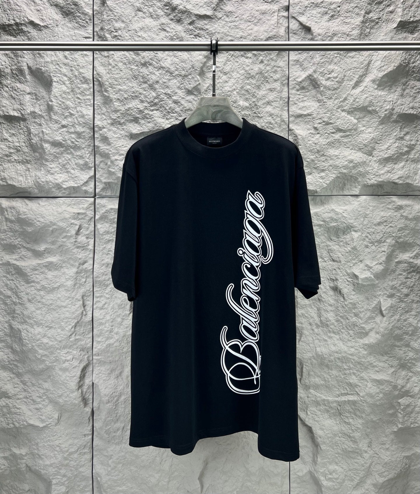 Black short-sleeve T-shirt with Balenciaga script logo on front