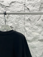 Black short-sleeve T-shirt back view, close to shoulder