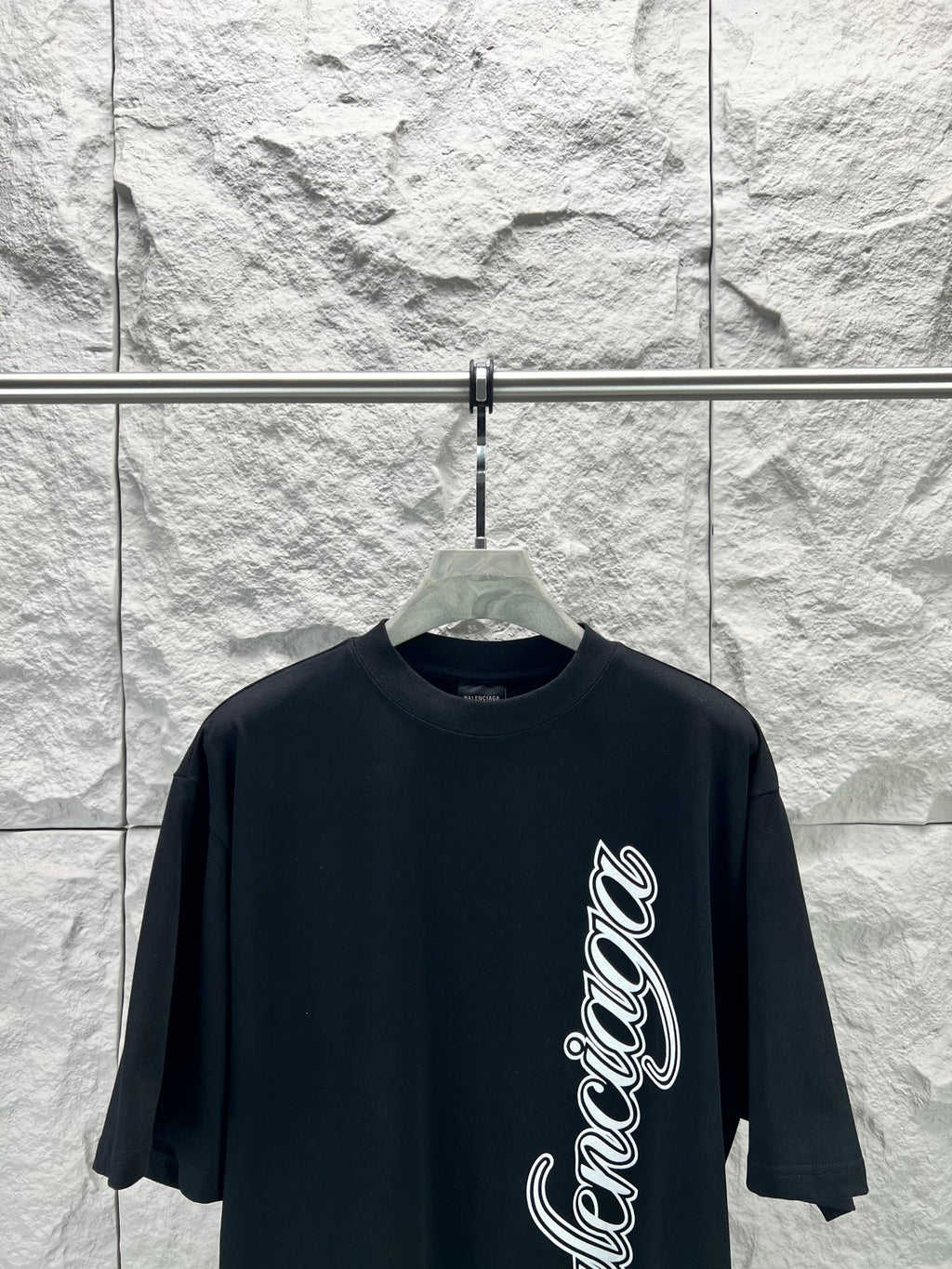 Black short-sleeve T-shirt with Balenciaga script logo on front