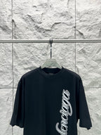 Black short-sleeve T-shirt with Balenciaga script logo on front