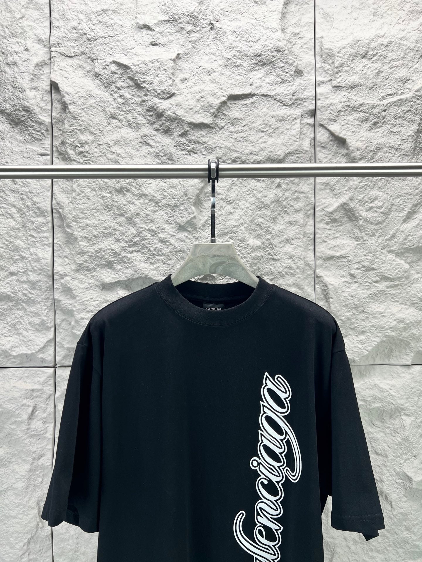 Black short-sleeve T-shirt with Balenciaga script logo on front