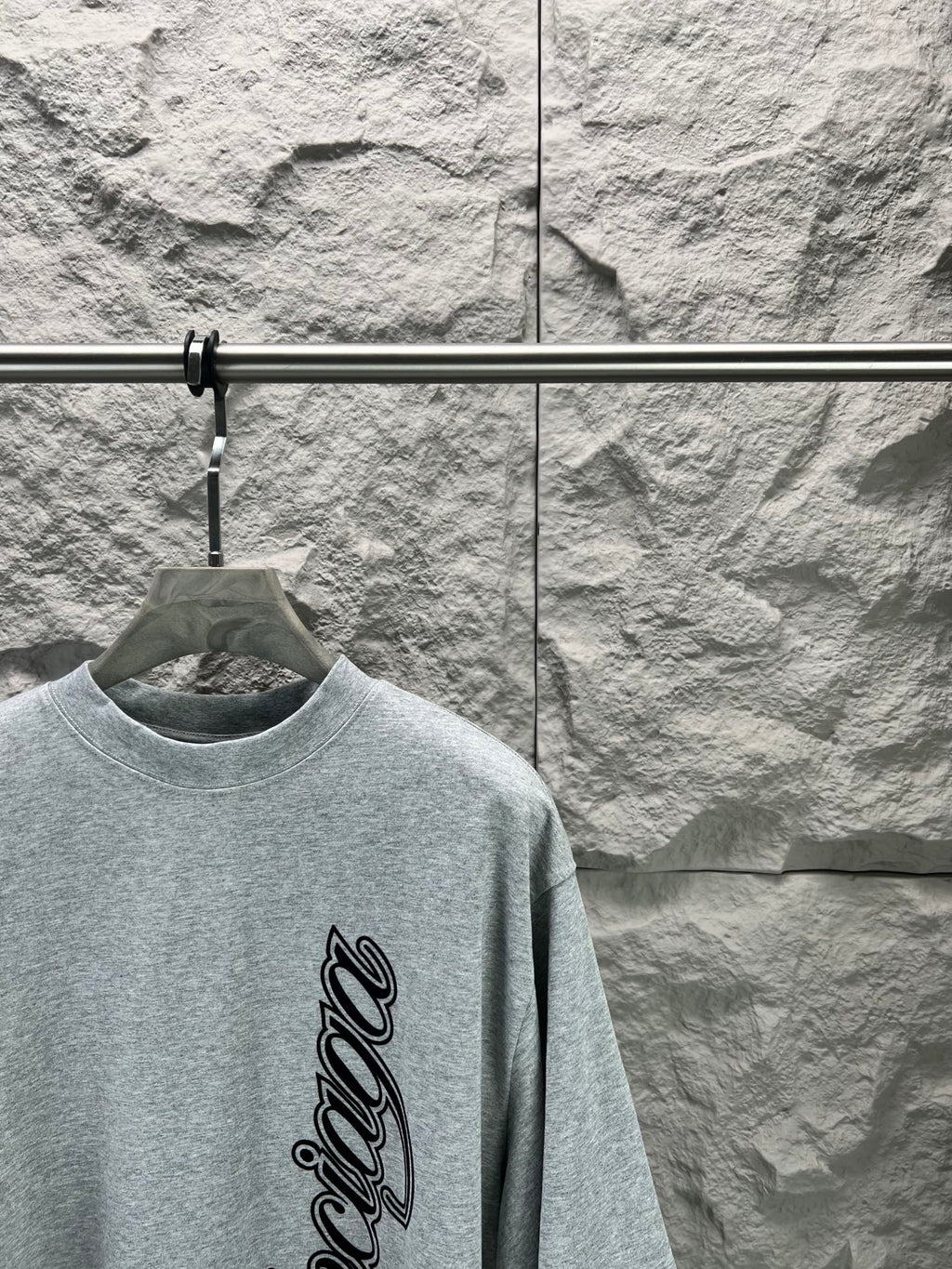Light blue short-sleeve T-shirt with crew neck and vertical Balenciaga logo script