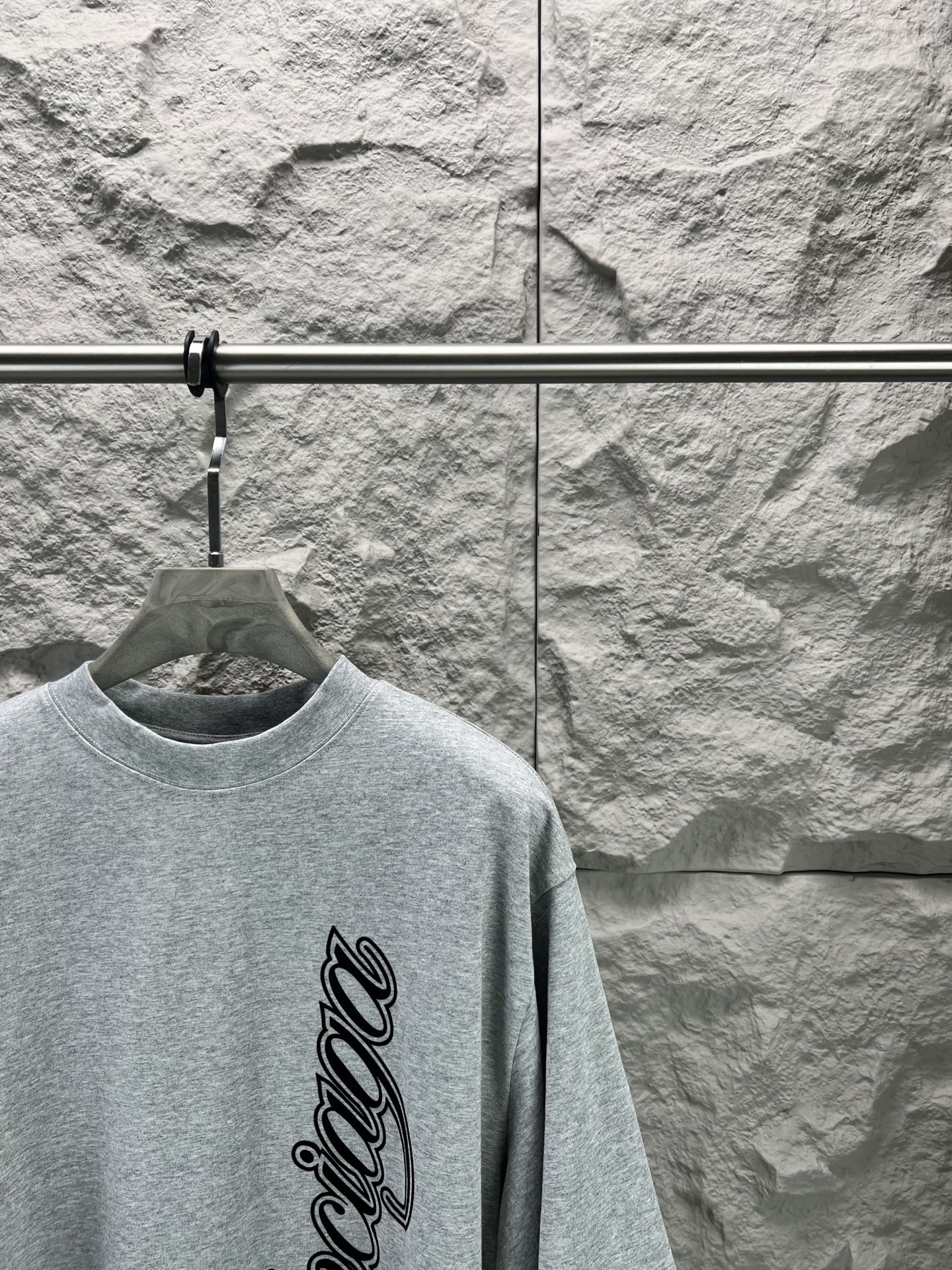 Light blue short-sleeve T-shirt with crew neck and vertical Balenciaga logo script