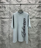 Light blue short-sleeve T-shirt with Balenciaga logo on front