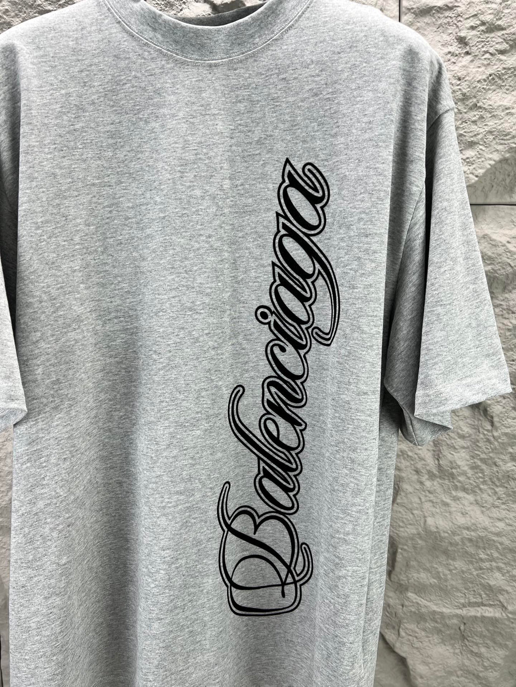 Light blue short-sleeve T-shirt close-up of Balenciaga logo script print