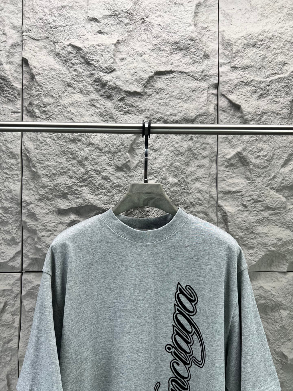 Light blue short-sleeve T-shirt with Balenciaga logo script on front
