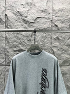Light blue short-sleeve T-shirt with Balenciaga logo on front